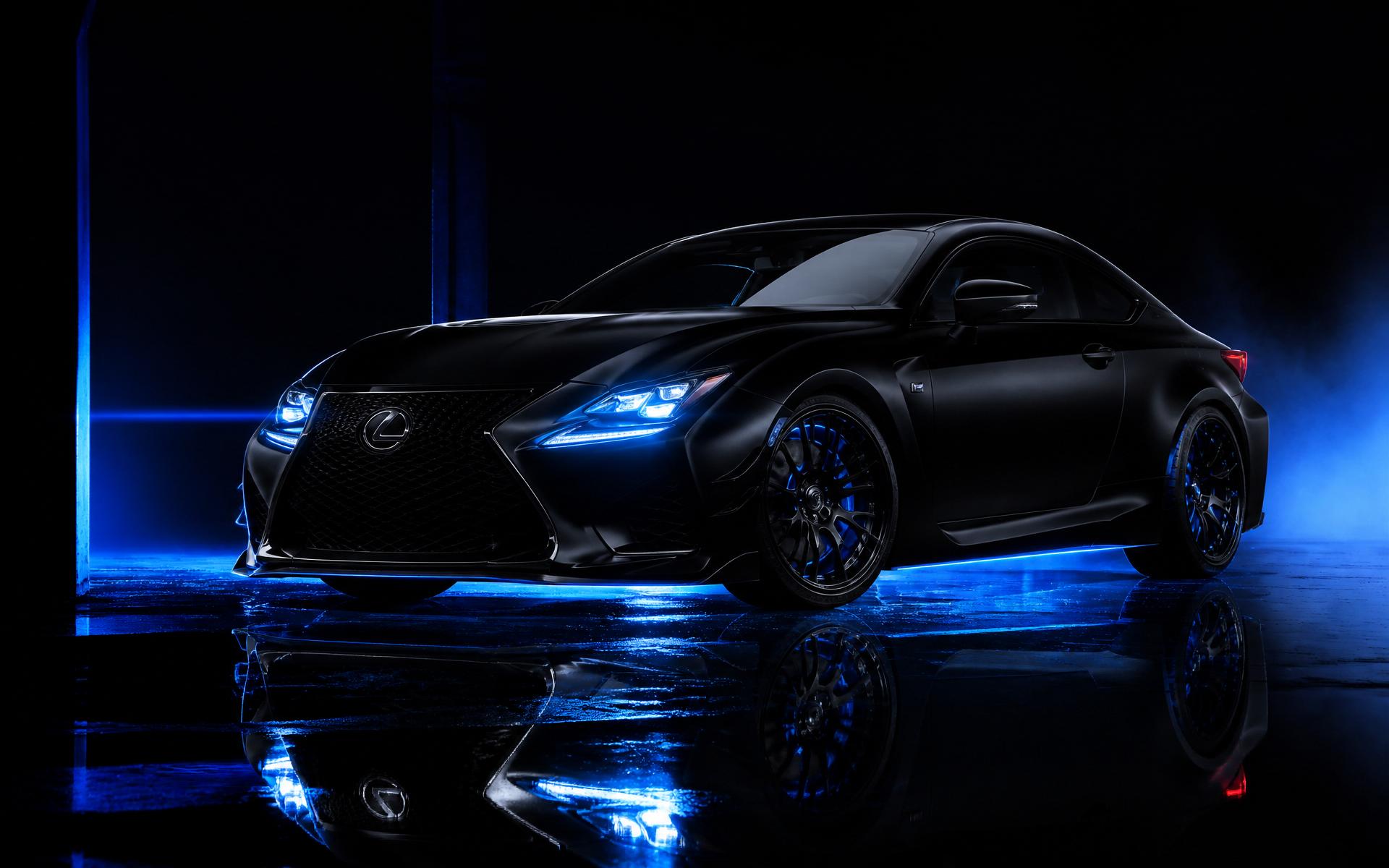 Matte black luxury sports car with electric blue ambient lighting